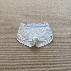 Zella Speedster white running shorts with colorful striped band